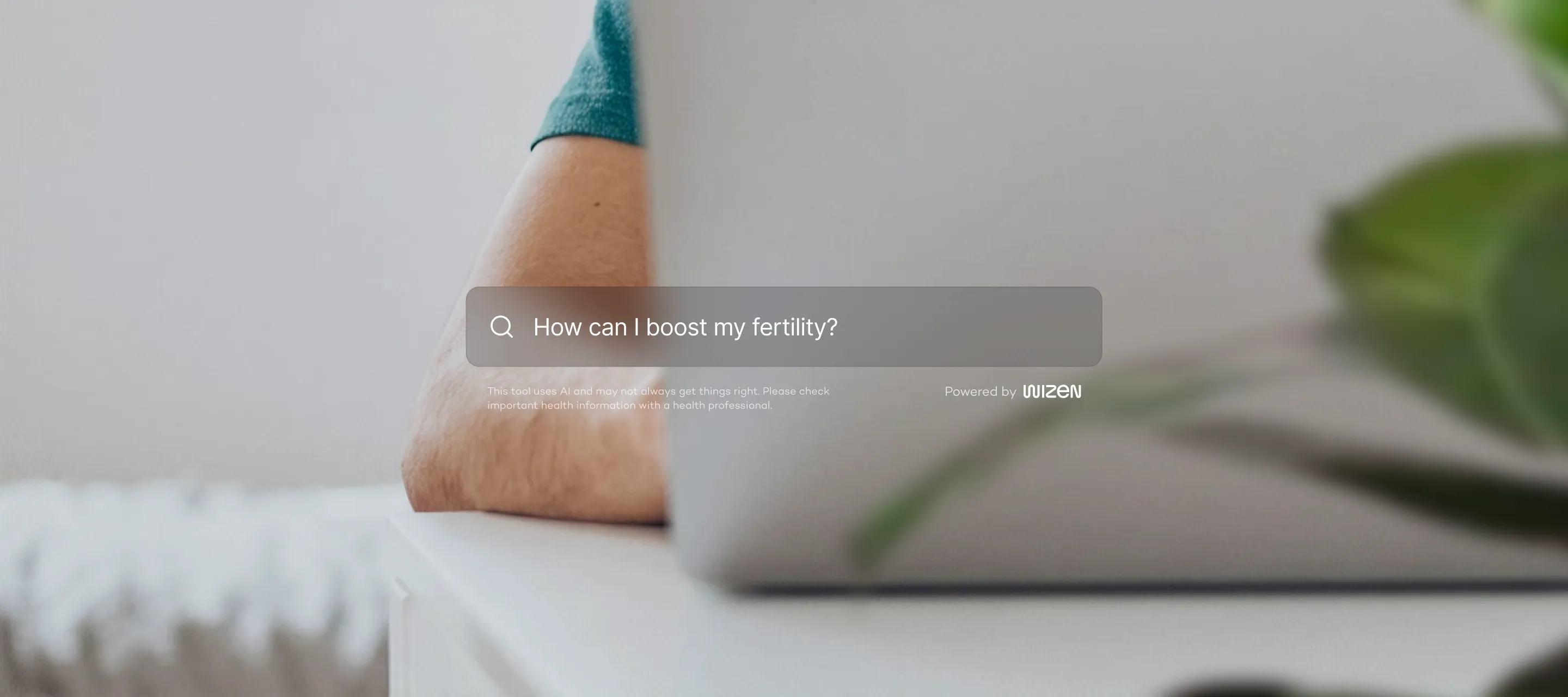 A person at a laptop with the Wizen search bar asking how to boost fertility